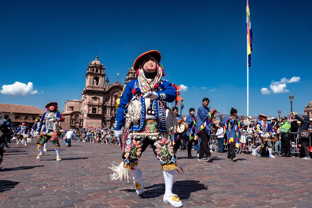 People in Colorful Costume Dancing at a Parade in Cuzco, Peru